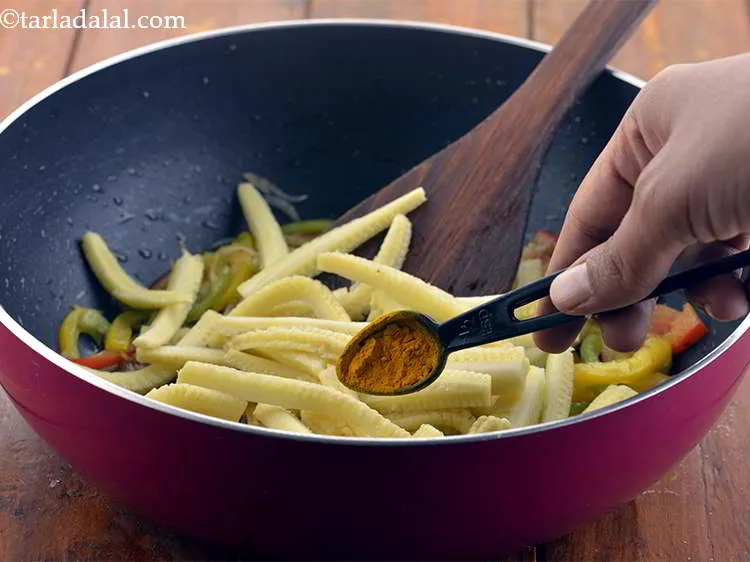 Step 8 – Then, we add the spices. First add the turmeric powder.