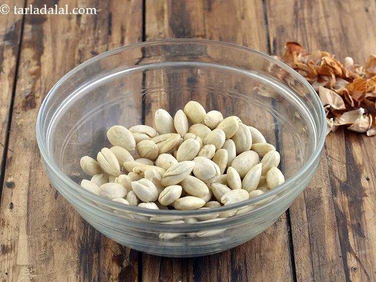 Step 24 – Next add the peeled almonds in a mixer jar.&nbsp;