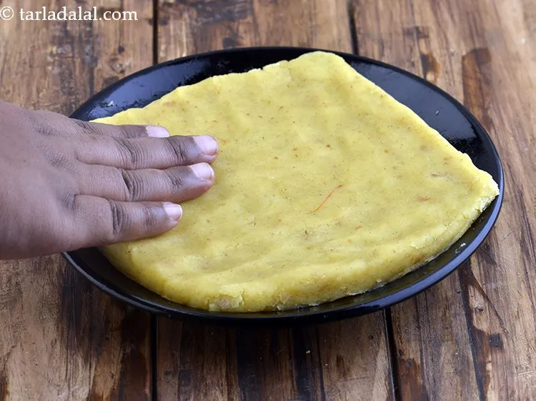 Step 34 – Pour the mixture immediately into a 175 mm. (7&rdquo;) diameter greased plate and spread it …