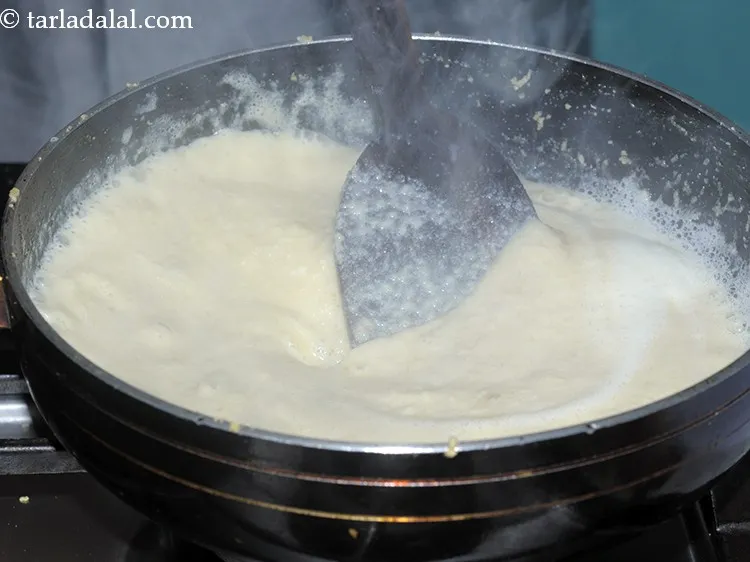 Step 20 – Once the badam and atta is well roasted and has a good aroma, add the …
