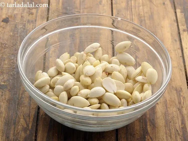 Step 10 – De-skin the almonds and discard the skin. To do this press each almond between a …