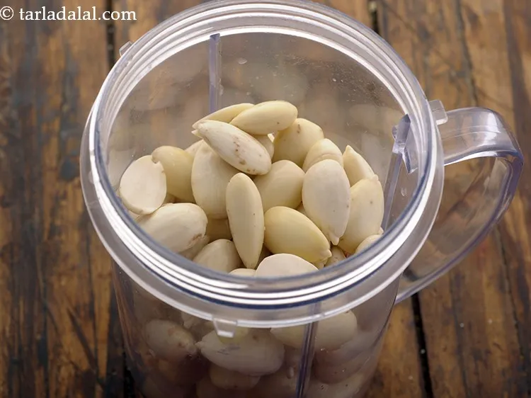 Step 11 – Transfer the soaked and de-skinned almonds to a mixer jar.