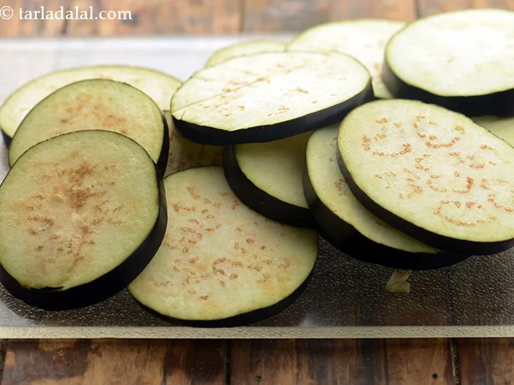Step 1 – To make&nbsp;<strong>baingan bhaja recipe | Bengali begun bhaja | healthy eggplant snack | how to …