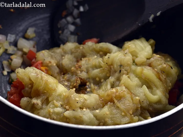 Step 17 – Add the mashed brinjal.