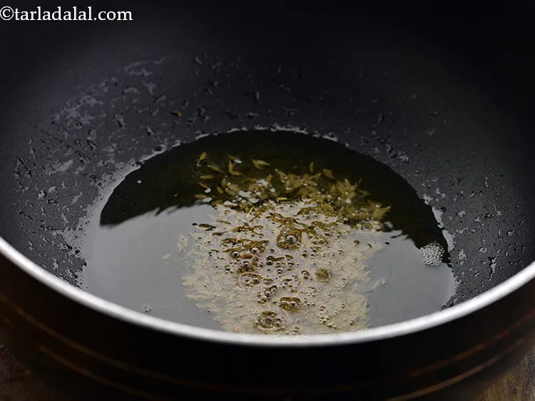 Step 7 – For preparing the <strong>Baingan Ka Bharta</strong>, heat the ghee in a pan and add the …