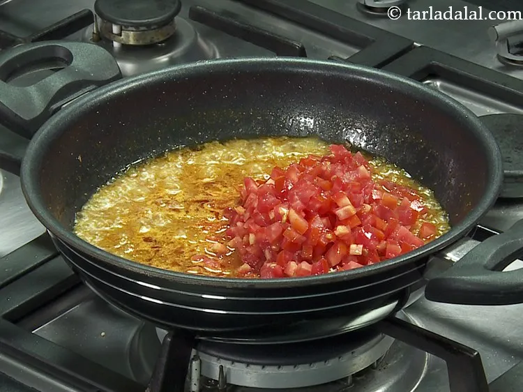 Step 17 – Add the tomatoes.