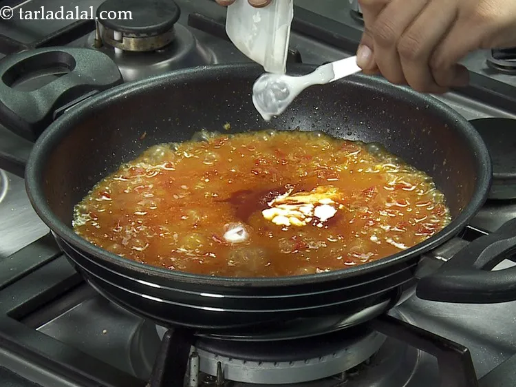 Step 21 – Add fresh cream. It adds a creamy texture to the shahi baingan sabzi.