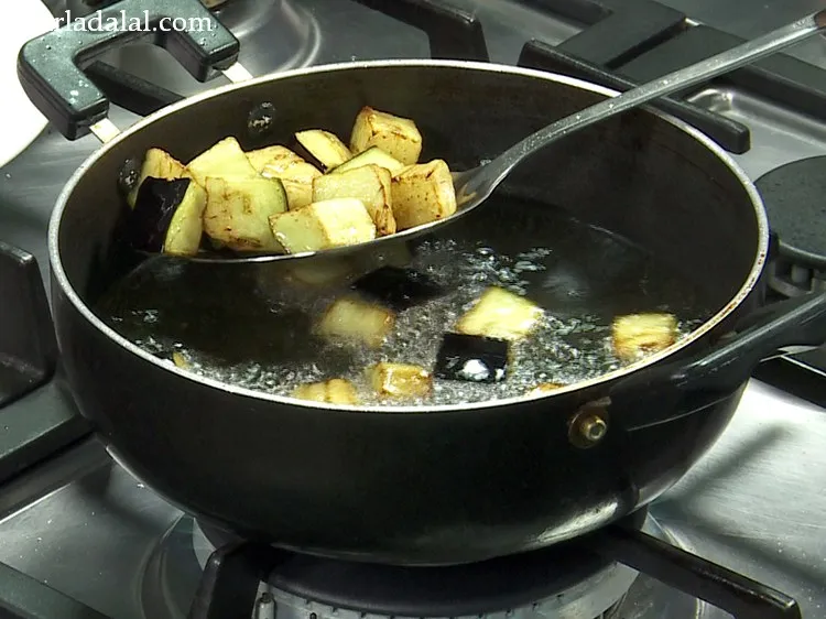 Step 4 – Fry them till they are golden brown in colour. To check if the aubergine is …