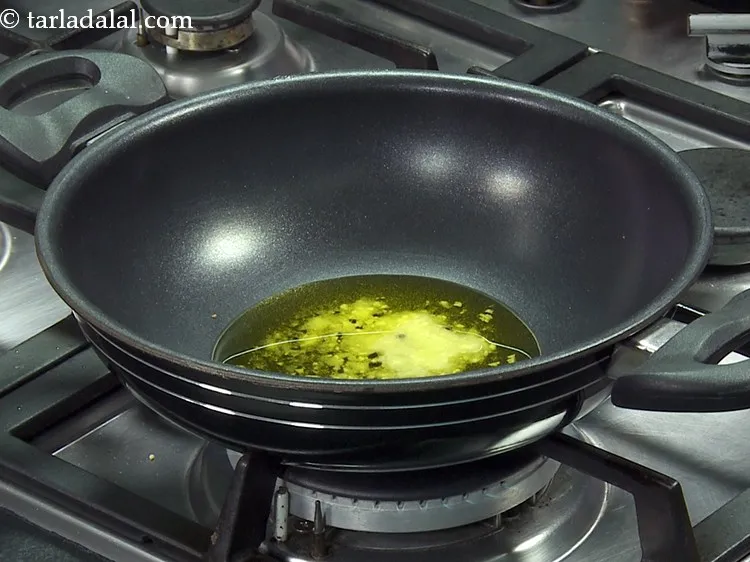 Step 7 – For tempering <strong>Mughlai baingan masala</strong>,&nbsp;heat the ghee in a deep non-stick kadhai. Ghee gives a …