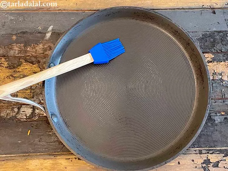Step 29 – <meta charset="UTF-8" /> Heat a non-stick tava (griddle) and grease it lightly with &frac14; tsp …