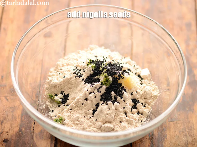 स्टेप 28 – १ टी-स्पून <a href=""https://www.tarladalal.com/glossary-nigella-seeds-kalonji-onion-seeds-hindi-552i"">कलौंजी</a> डालें। इन्हें तिल से बदला जा …