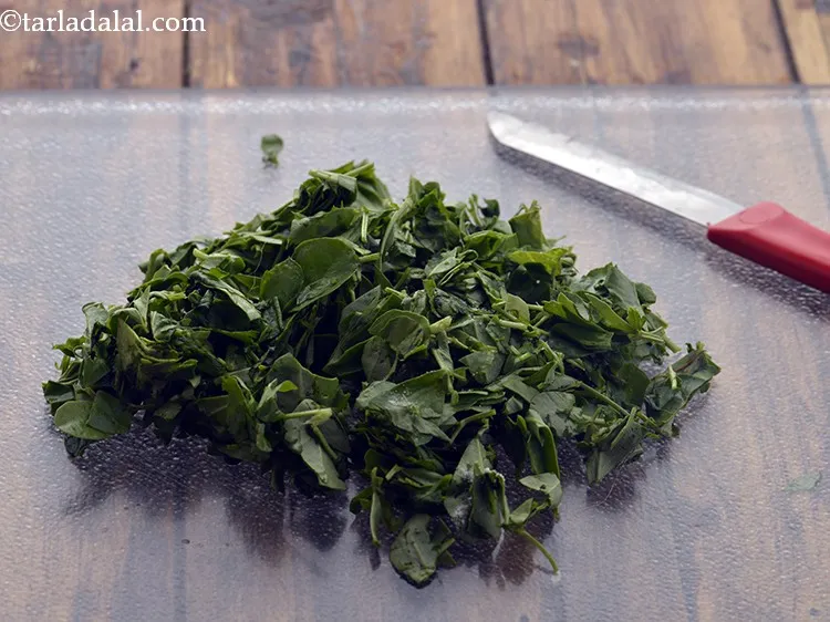 Step 3 – Chop the methi leaves, measure &frac14; cup and keep aside.