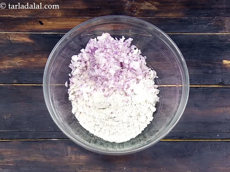 Step 3 – Add 1/2 cup&nbsp;finely&nbsp;<a href="https://www.tarladalal.com/glossary-chopped-onions-722i">chopped onions</a>&nbsp;to it. Ensure to chop them finely.&nbsp;Raw <a href="https://www.tarladalal.com/recipes-using-onions-548">onions</a> are a …