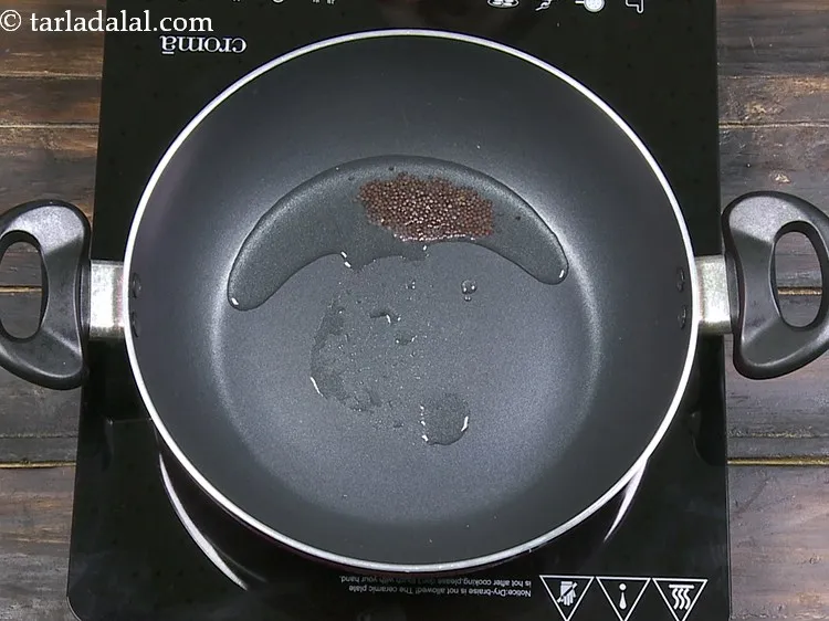 Step 23 – Add 1/2 tsp&nbsp;<a href="https://www.tarladalal.com/glossary-mustard-seeds-sarson-rai-sarson-ke-beej-525i">mustard seeds ( rai / sarson)</a>.