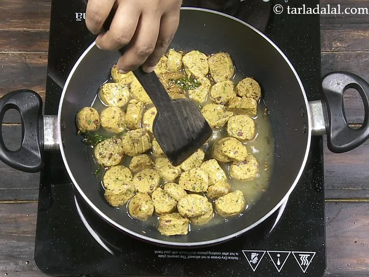 Step 30 – Mix the muthia pieces gently.&nbsp;