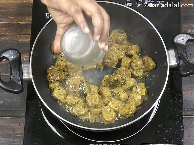 Step 32 – Add more &frac14; cup of water for further cooking.&nbsp;