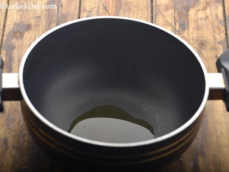 Step 10 – Now to make Pearl Millet Porridge for Babies, take a small non-stick pan. Add ghee …