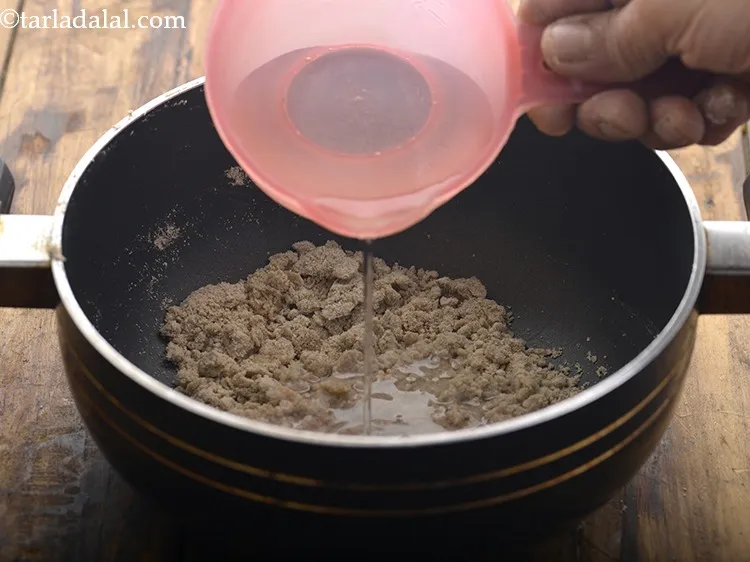 Step 14 – Add &frac34; cup of water. Adjust the quantity of water to get the porridge consistency. …