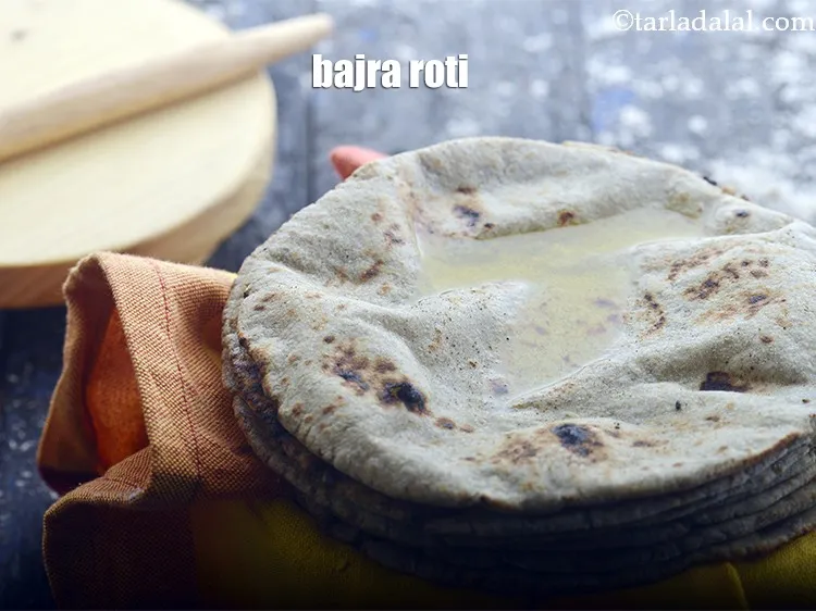 Step 40 – Serve khatta gobhi sabzi with bajra roti. See <a href="https://www.tarladalal.com/bajra-roti-3892r" target="_blank">how to make bajra roti.</a>