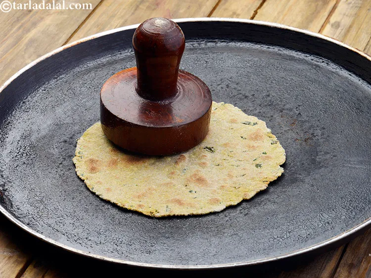 Step 45 – Use a khakhra press to cook your&nbsp;khakhra&nbsp;or a folded muslin cloth.