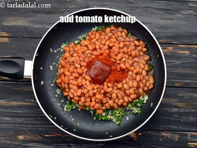Step 13 – Add 2 tbsp&nbsp;<a href="https://www.tarladalal.com/glossary-tomato-ketchup-tomato-sauce-181i">tomato ketchup</a>.