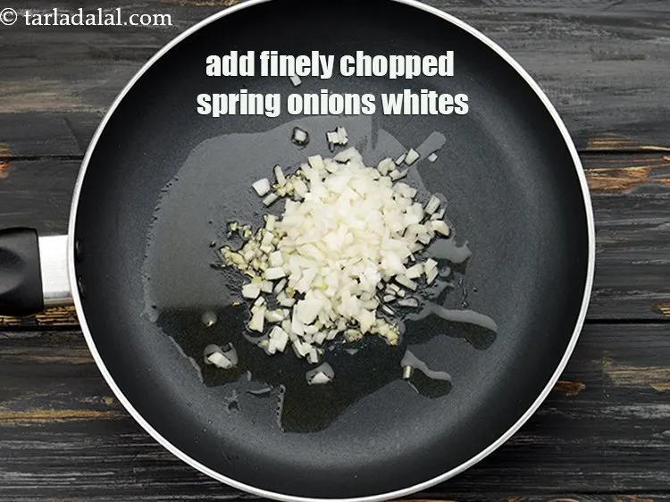 Step 7 – Add 1/4 cup&nbsp;finely&nbsp;<a href="https://www.tarladalal.com/glossary-chopped-spring-onion-whites-815i">chopped spring onions whites</a>.