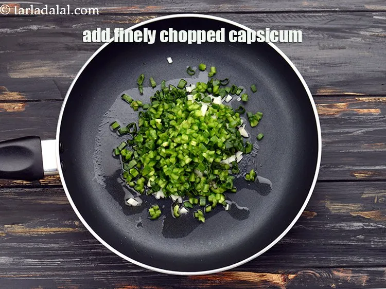 Step 9 – Add 1/4 cup&nbsp;finely&nbsp;<a href="https://www.tarladalal.com/glossary-chopped-capsicum-164i">chopped capsicum</a>.