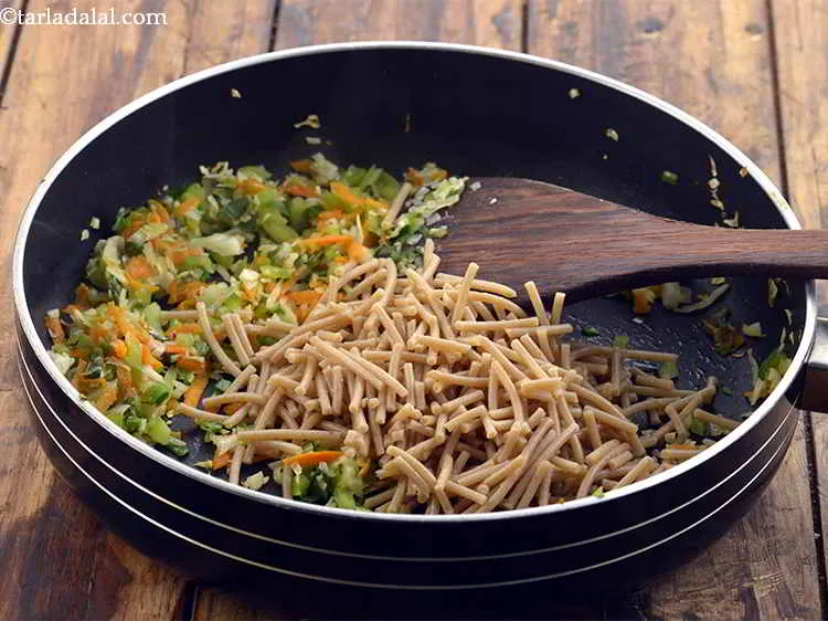 Step 16 – Now, its time to add the boiled and roughly chopped noodles.