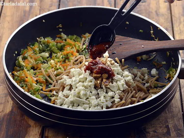 Step 19 – Add schezuan sauce to spice it up.