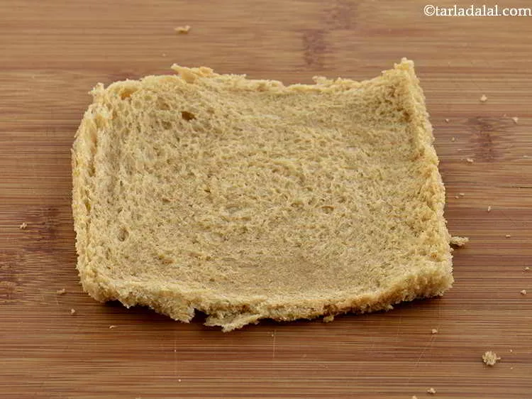 Step 24 – &nbsp;Roll each bread slice using a rolling pin.