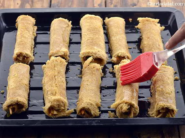 Step 30 – Brush little butter evenly on top of the bread rolls to enhance the flavor and …