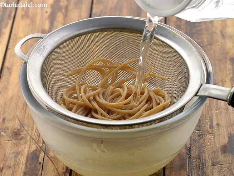 Step 8 – Pour some cold water over the noodles to stop carry-over cooking.