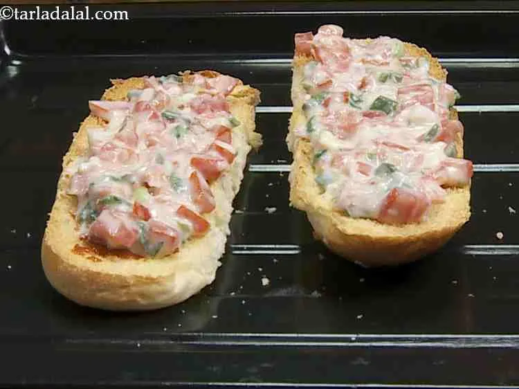 Step 15 – Spread a portion of the prepared topping on each toasted halve.