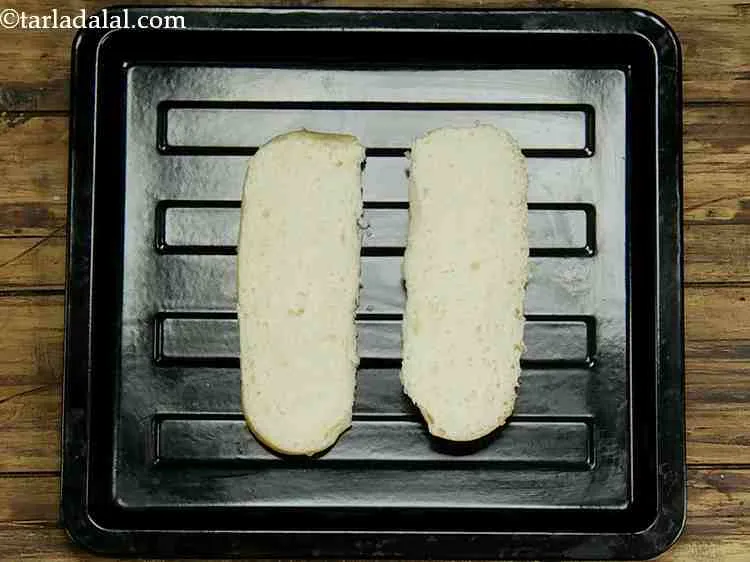 Step 10 – Divide a hot dog roll horizontally into two parts.