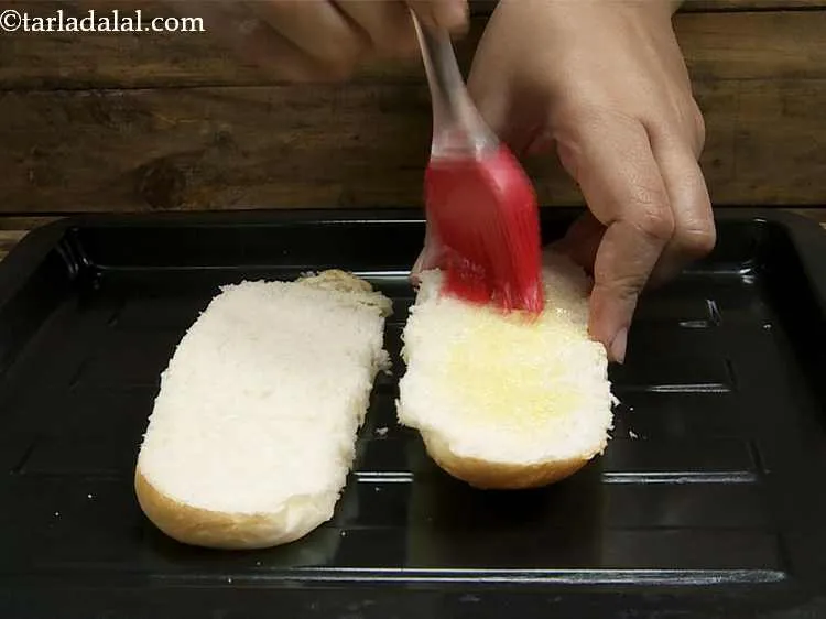 Step 11 – Brush the sides of each halve with a little melted butter.