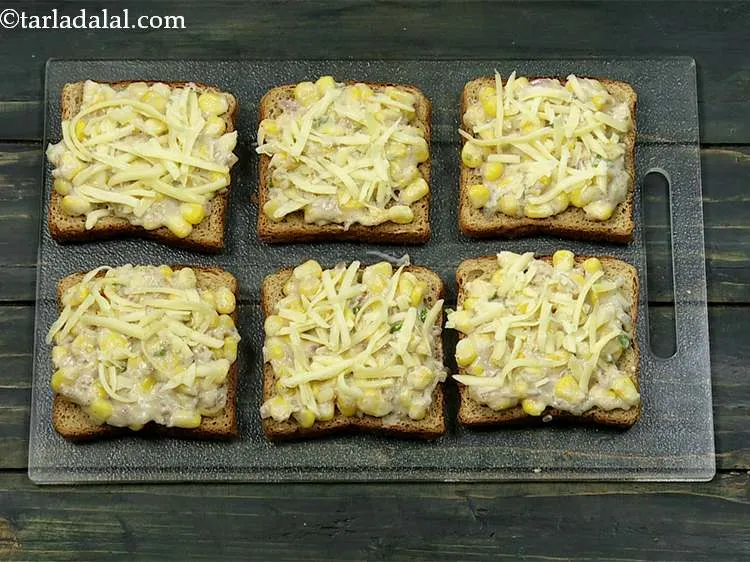 Step 19 – Sprinkle &frac12; tbsp of cheese evenly on each bread toast.