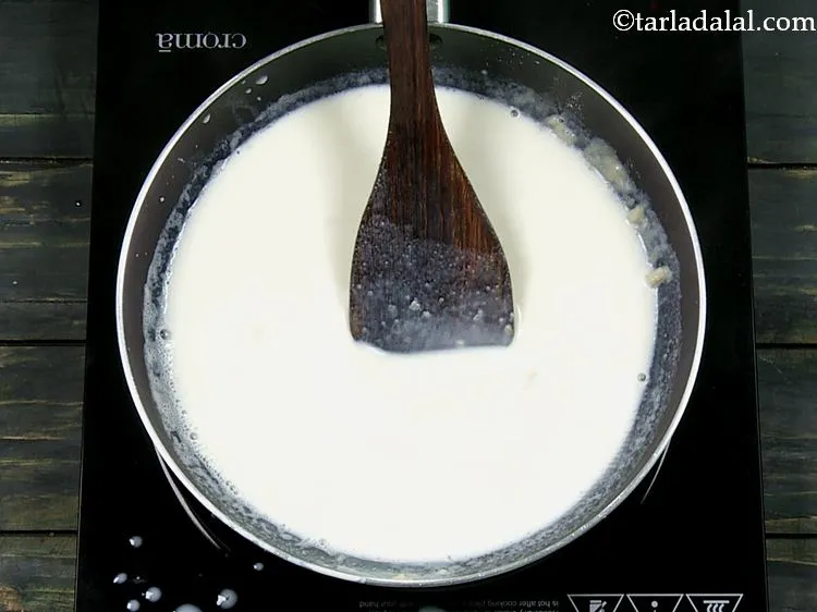 Step 4 – When the flour turns frothy and pale, add the milk. The flour and butter mixture …