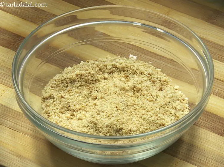 Step 3 – For the biscuit base of<strong> Baked gulab jamun cheesecake</strong>, in a deep bowl take the …