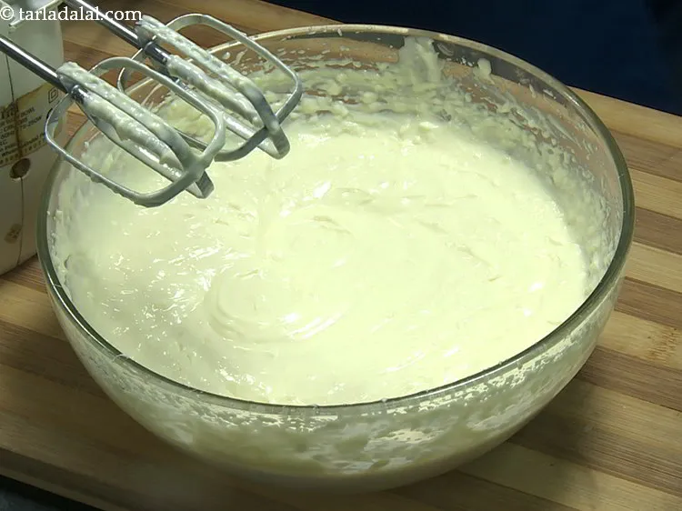 Step 15 – Beat again till smooth and our <strong>Gulab Jamun cheesecake</strong> mixture is ready to bake. Keep …