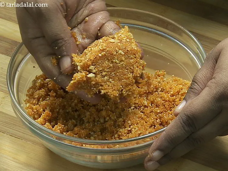 Step 5 – Mix well while pressing lightly to bind well. Since the ladoos already have a lot …