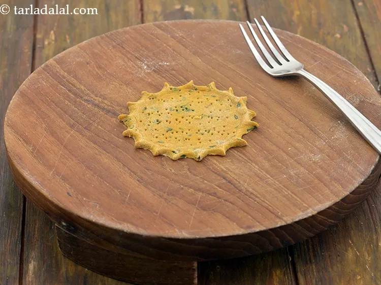 Step 27 – Prick the mathri with a fork at regular intervals. This helps to make the mathri …