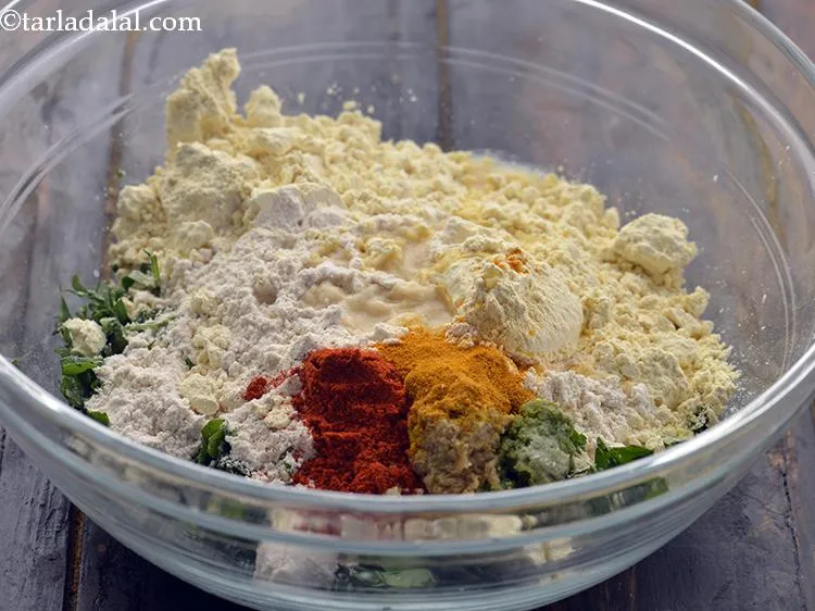 Step 9 – Add the turmeric powder. Add the chilli powder. If you want the methi muthiya spicier …