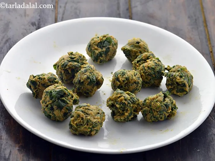 Step 14 – For baking the <strong>Baked Methi Muthia</strong>, divide the mixture into 12 equal portions. If you …