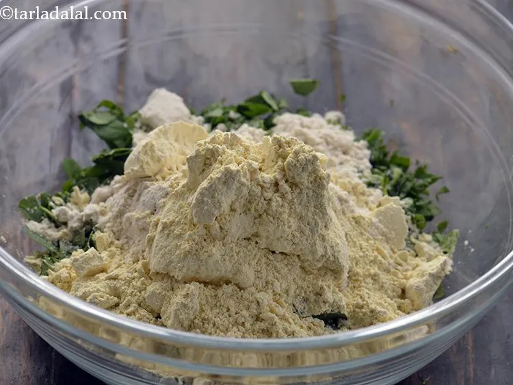 Step 6 – Add the besan. You can also add jowar, bajra or ragi flour to the <strong>Baked …