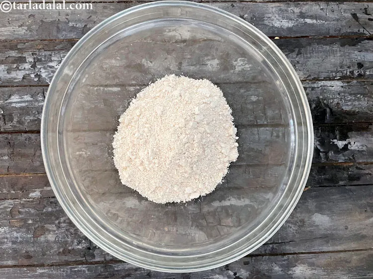 Step 10 – <meta charset="UTF-8" />To make&nbsp;baked oats puris,&nbsp;put&nbsp;<meta charset="UTF-8" />1/2 cup&nbsp;<a href="glossary-oats-flour-oats-atta-2201i">oats flour</a>&nbsp;in a glass bowl.