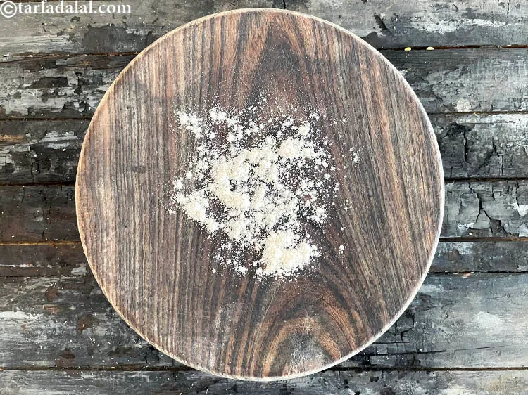 Step 24 – Dust a rolling board with whole wheat flour.