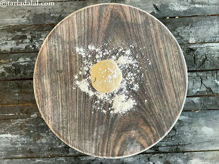 Step 25 – Place a portion of the dough on the dusted rolling board.