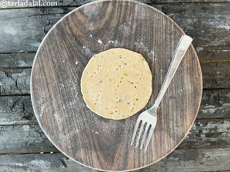 Step 27 – Prick the rolled out puris with a fork at regular intervals.