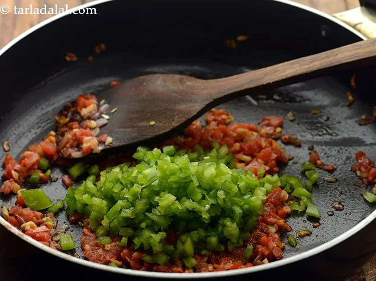 Step 21 – Add capsicum. Other veggies like cauliflower, carrots, bell peppers can also be added.