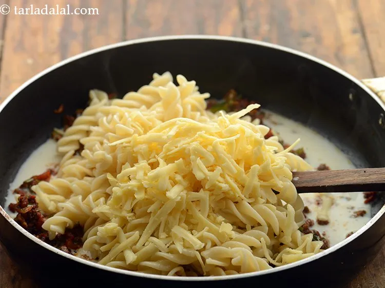 Step 26 – Add &frac14; cup cheese.